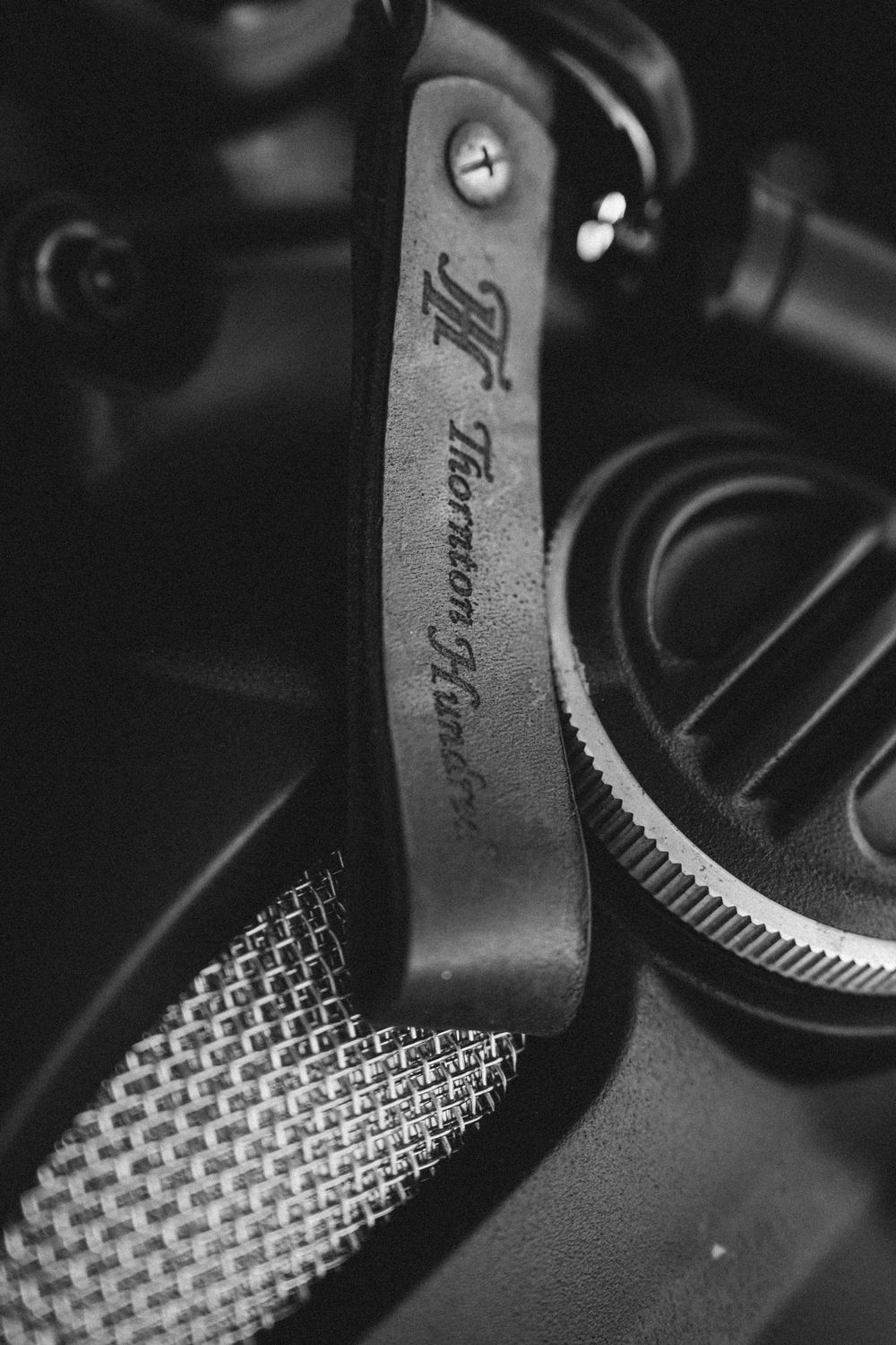 Close-up macro shot of typewriter hammers showing textured metal pattern in black and white.
