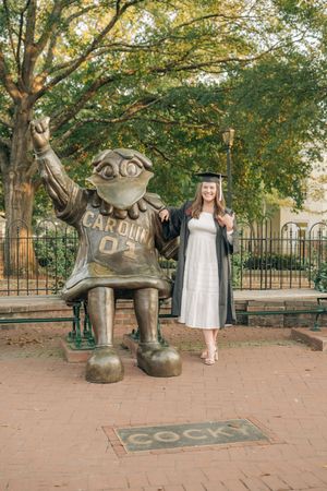 A series of photos showing a bronze Cocky statue at the University of South Carolina campus on a brick walkway.