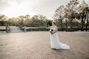 Sunset bridal portraits at an outdoor venue with golden hour lighting.