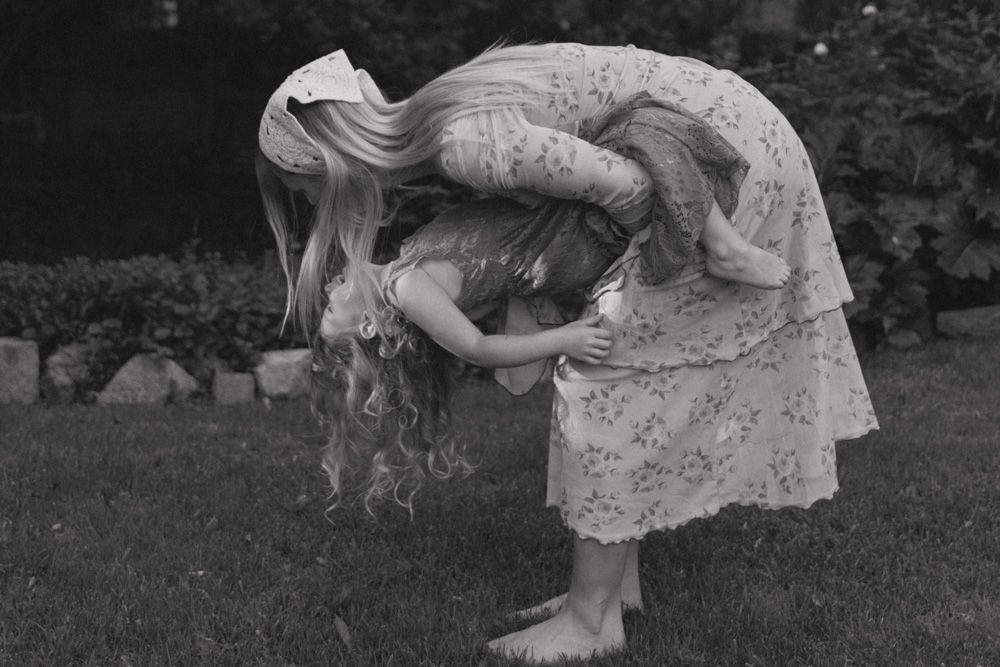 A mother and daughter playing in the background laughing together.