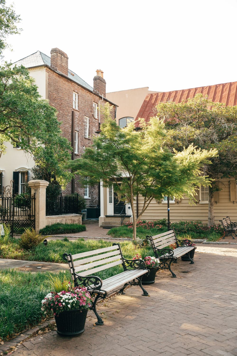 Park benches in Charleston with historic brick buildings in the background, Atlanta interior photography