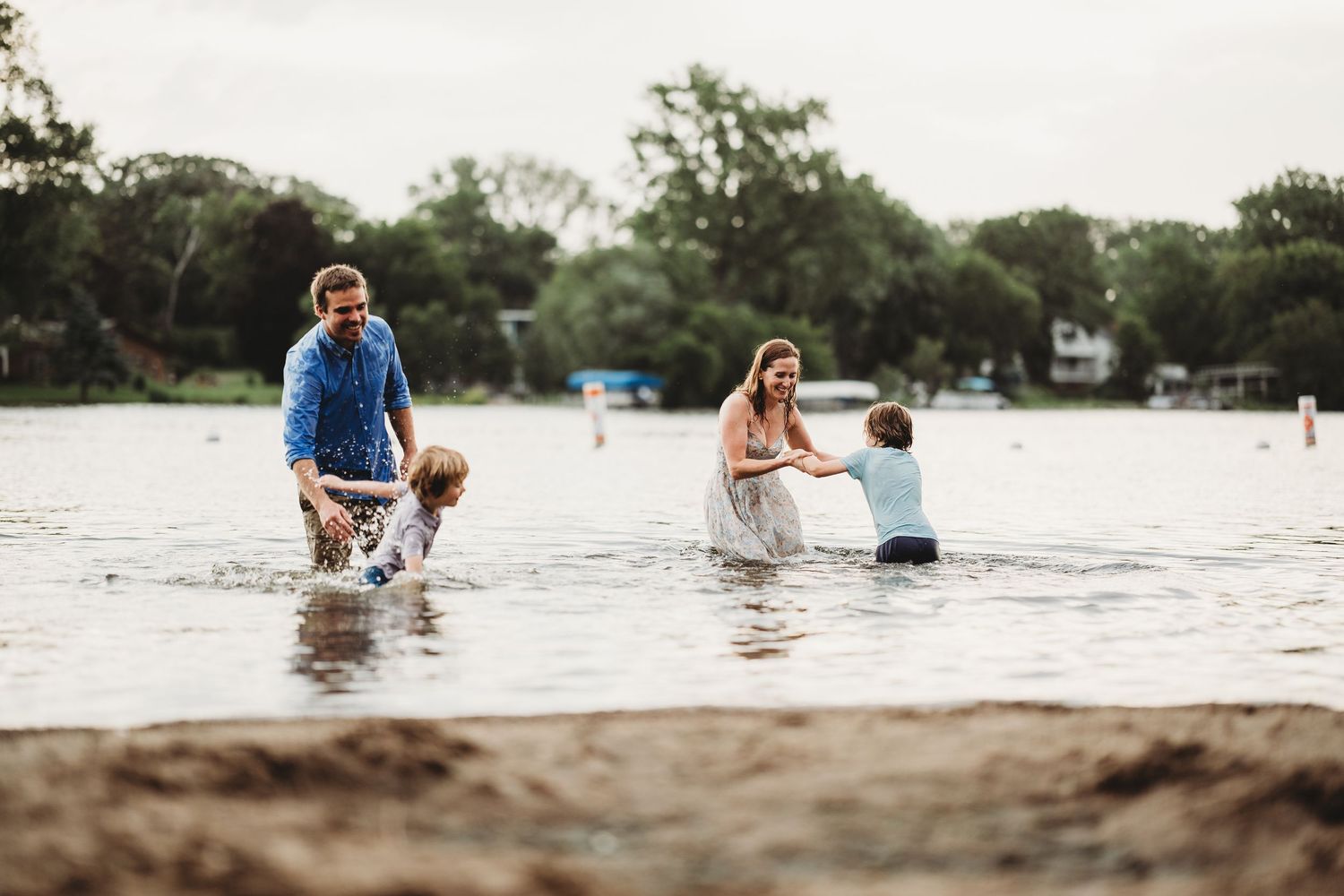 Group of people enjoying a sunny day by the water's edge.