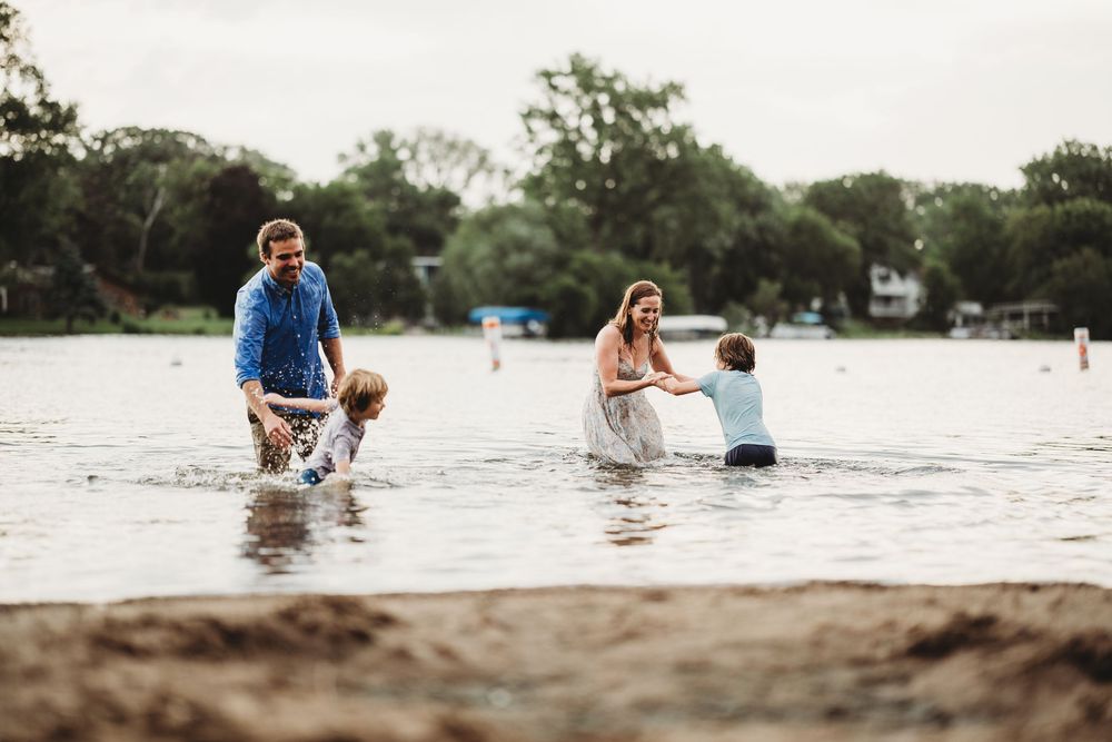 Group of people enjoying a sunny day by the water's edge.