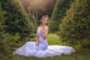 An elegant sweet 16 portrait photo taken in a tree-lined avenue with natural lighting in the Hudson Valley,NY.