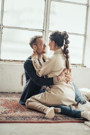 a photo of a beautiful couple during a love shoot in an urban industrial environment