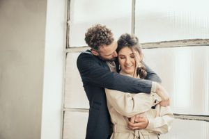 a photo of a beautiful couple during a love shoot in an urban industrial environment