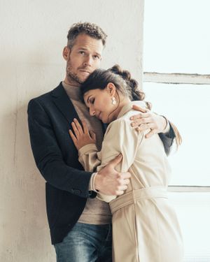 a photo of a beautiful couple during a love shoot in an urban industrial environment