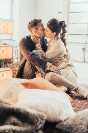 a photo of a beautiful couple during a love shoot in an urban industrial environment