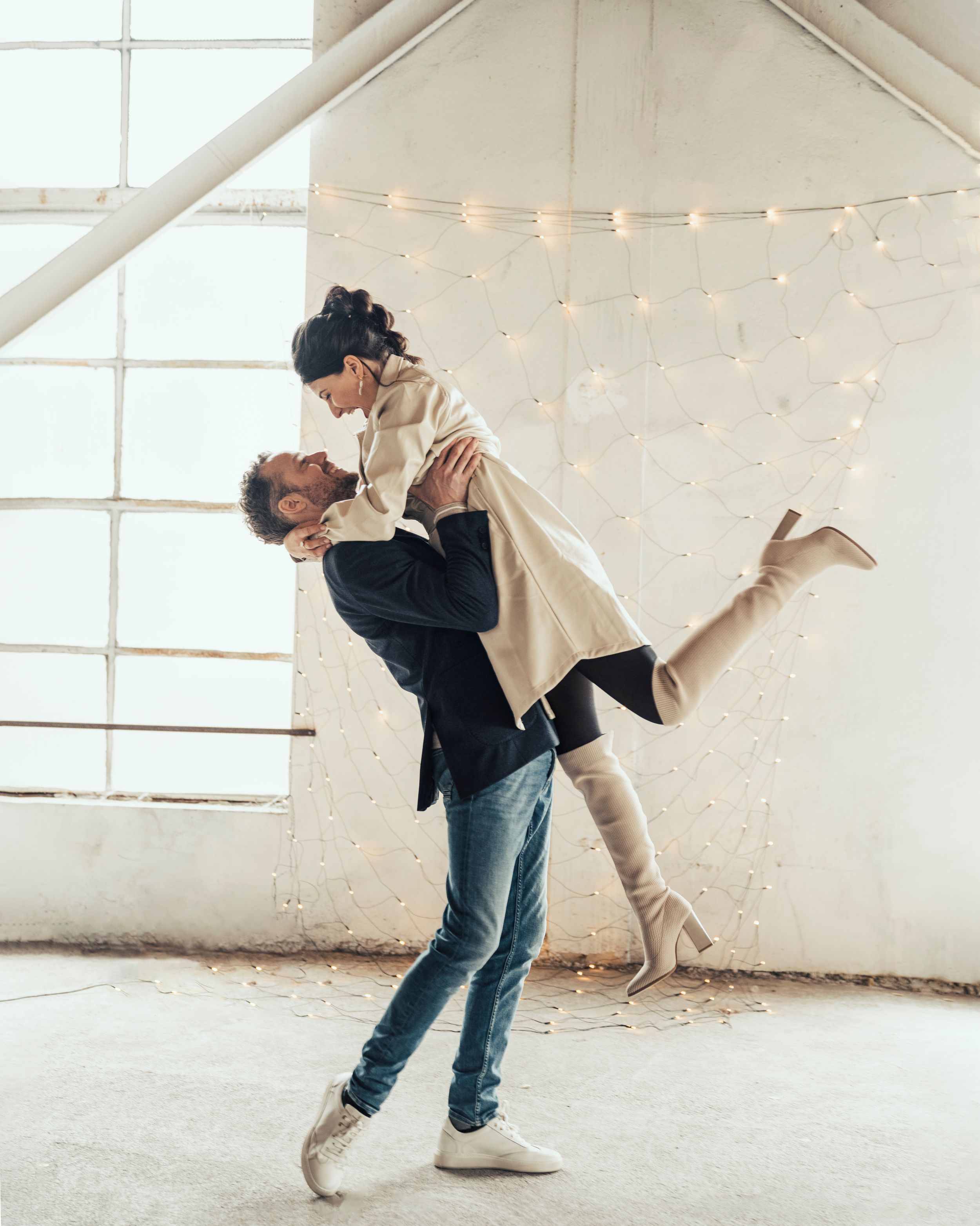 a photo of a beautiful couple during a love shoot in an urban industrial environment