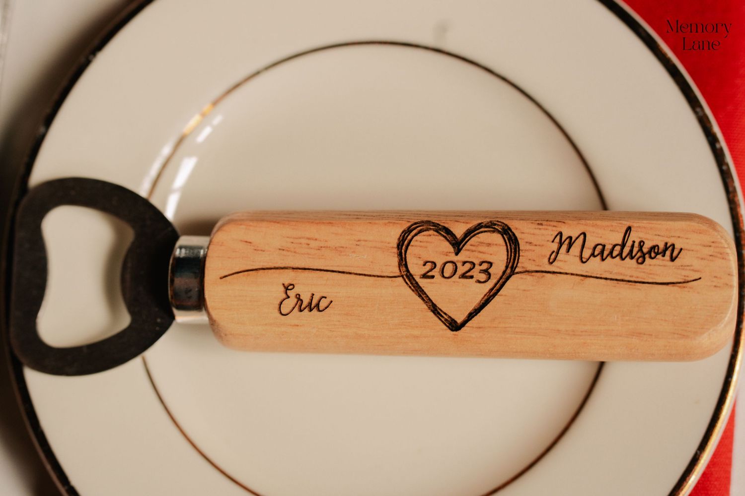 Wooden place cards with engraved names and hearts for wedding table settings.