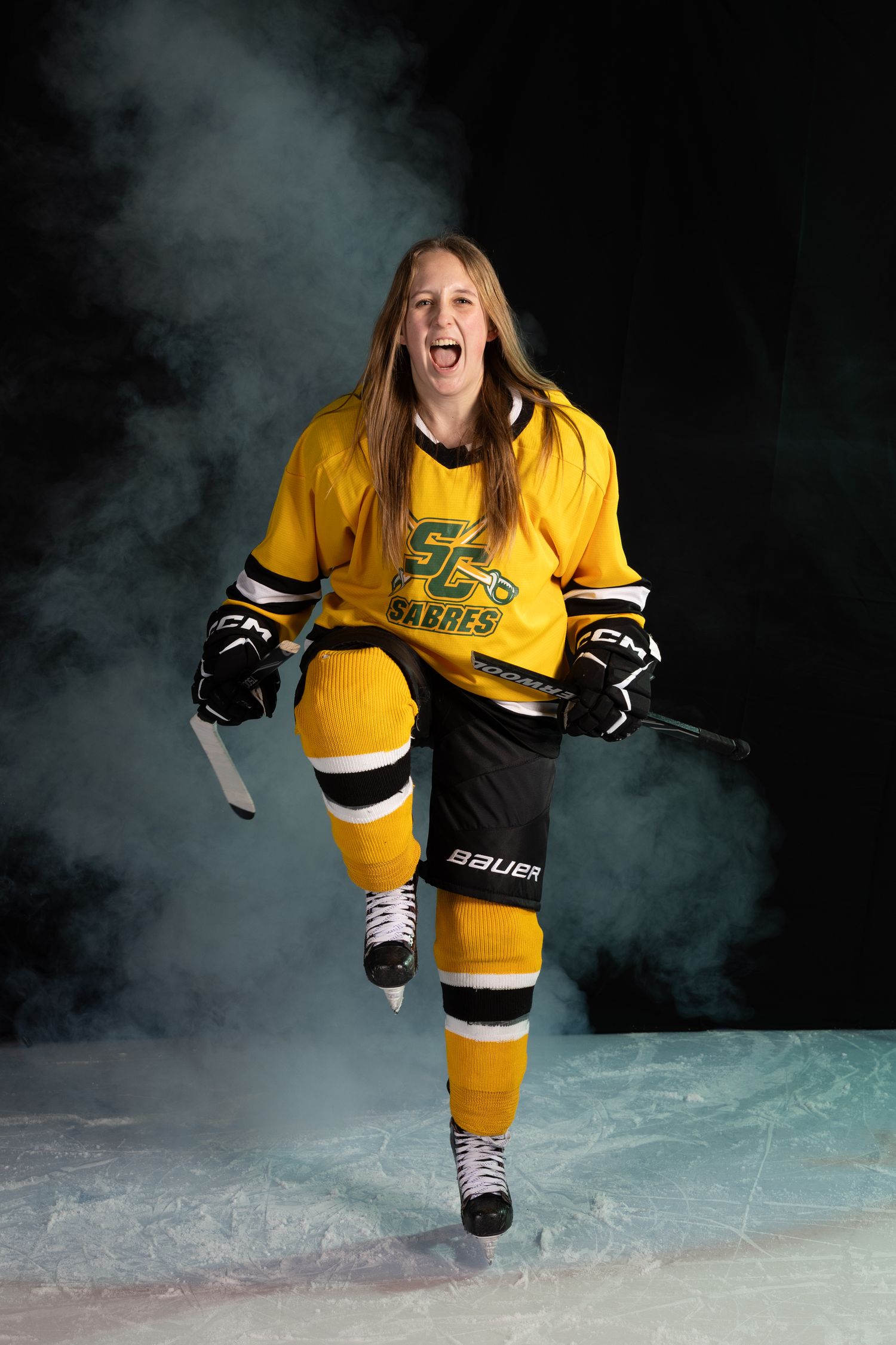 Stoney Creek Sabres Girls hockey player posing during on ice portrait session in Stoney Creek