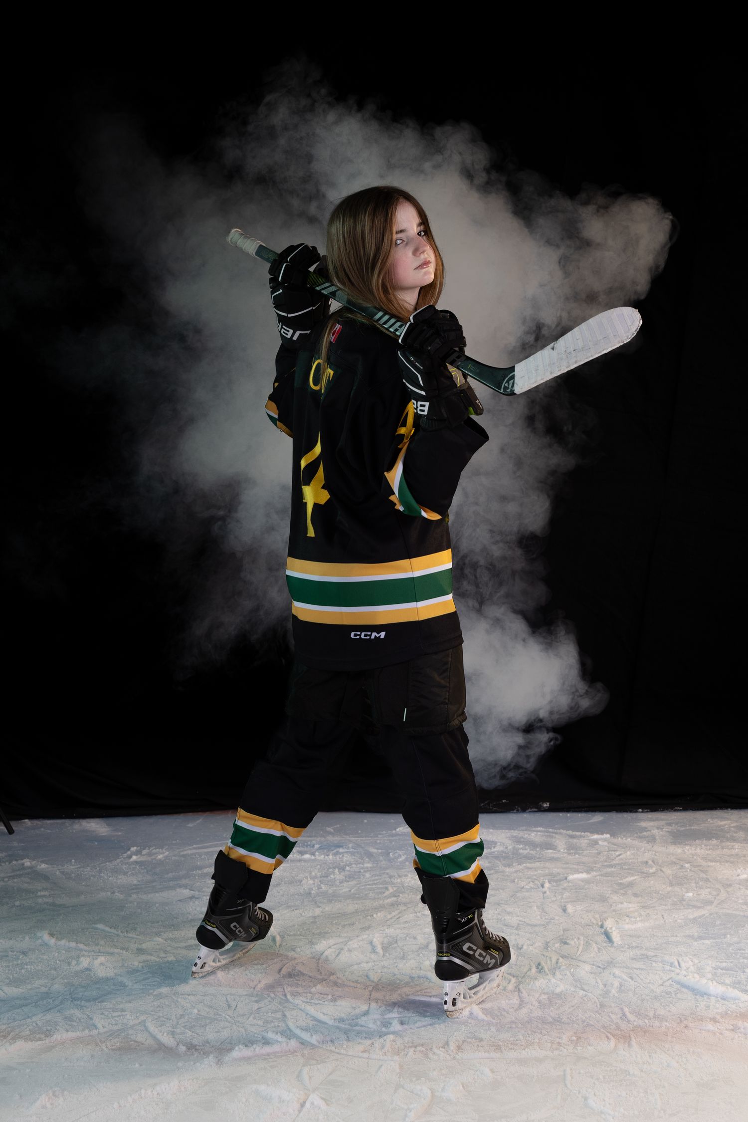 Stoney Creek Sabres Girls hockey player posing during on ice portrait session in Stoney Creek