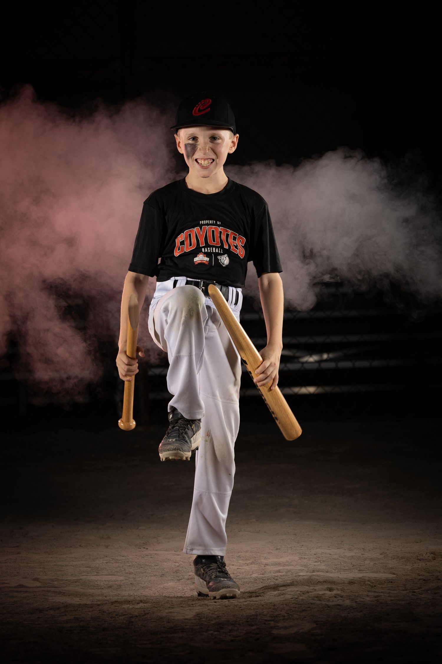 Grimsby Coyote Boys Baseball player posing for an outdoor portrait session in Grimsby Niagara