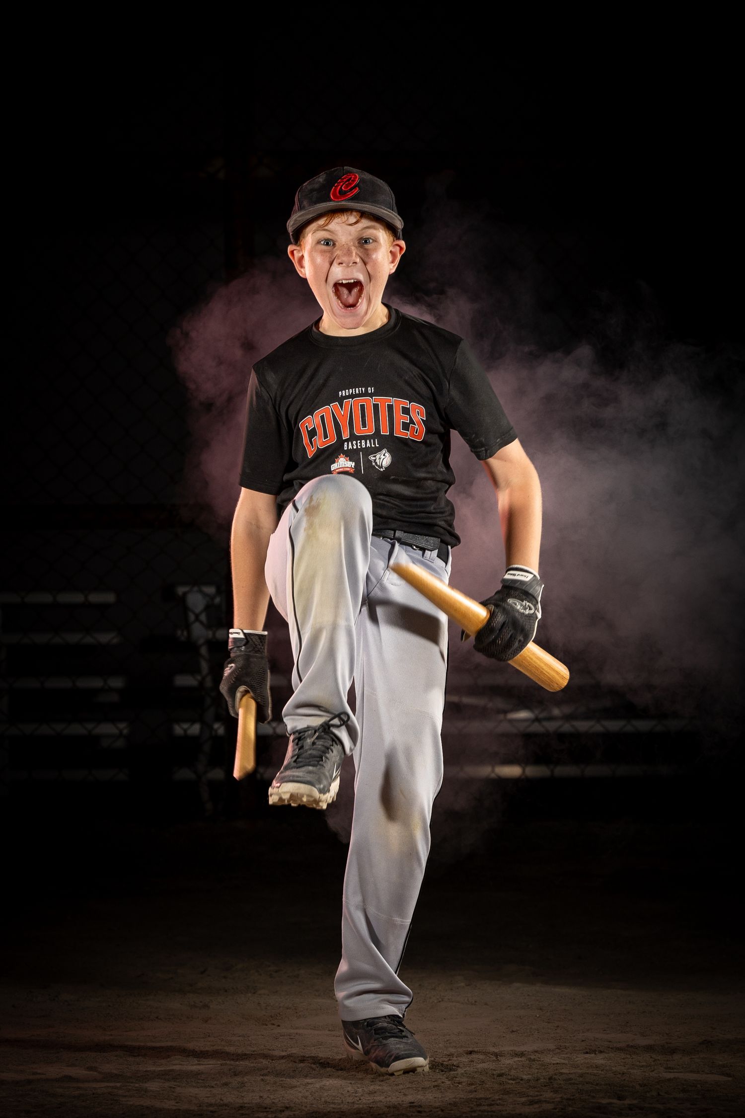 Grimsby Coyote Boys Baseball player posing for an outdoor portrait session in Grimsby Niagara