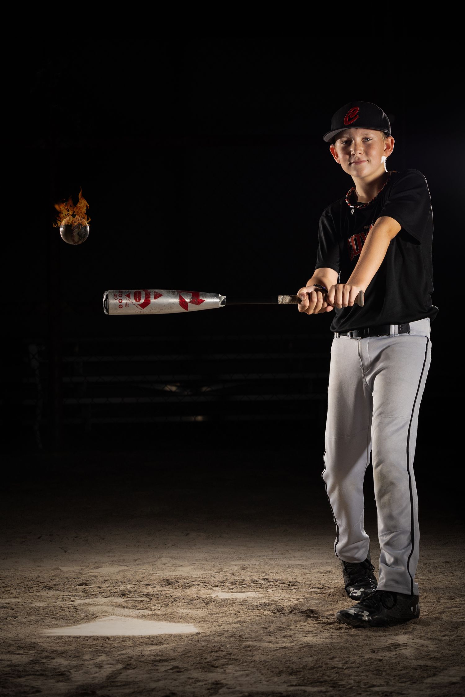 Grimsby Coyote Boys Baseball player posing for an outdoor portrait session in Grimsby Niagara