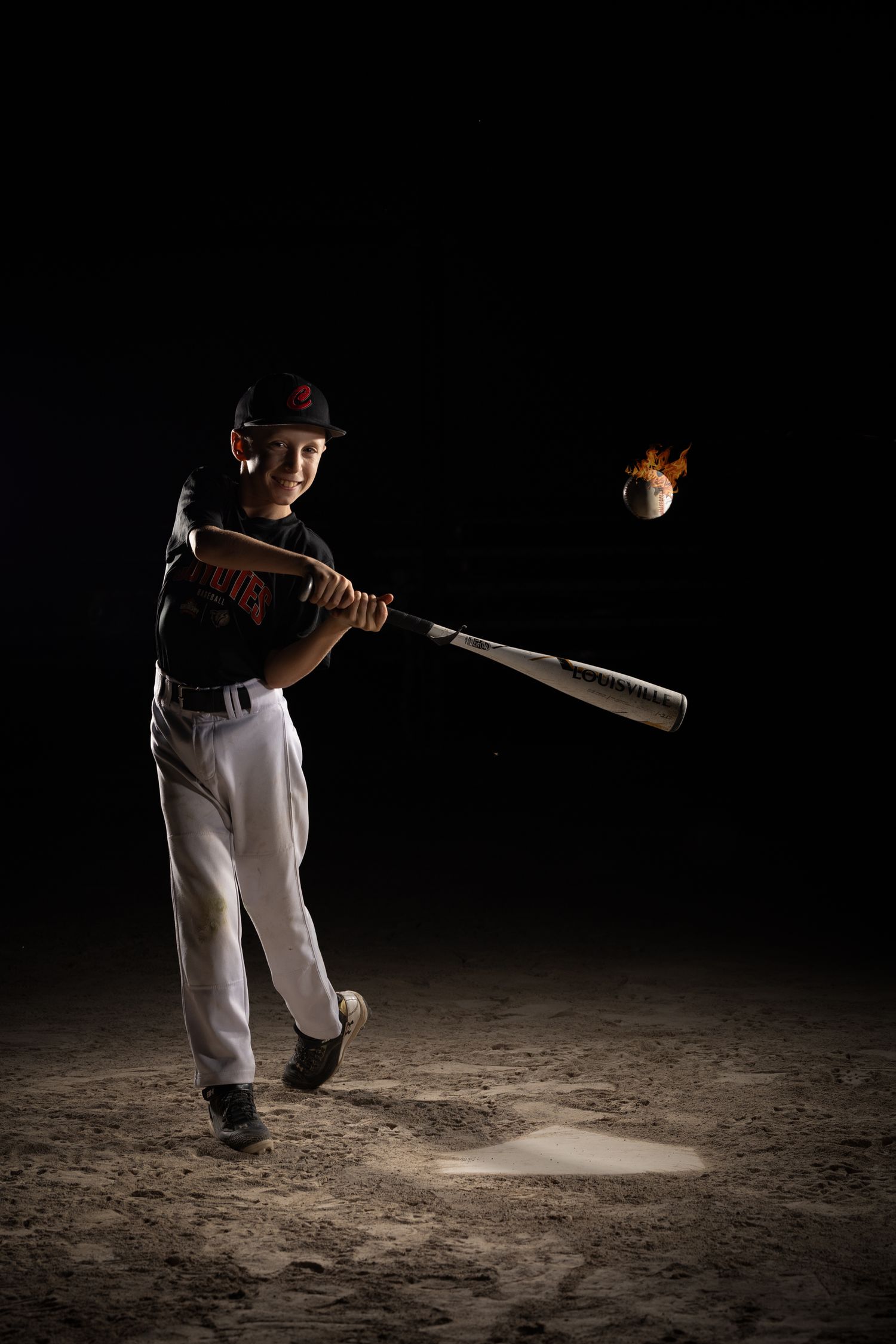 Grimsby Coyote Boys Baseball player posing for an outdoor portrait session in Grimsby Niagara