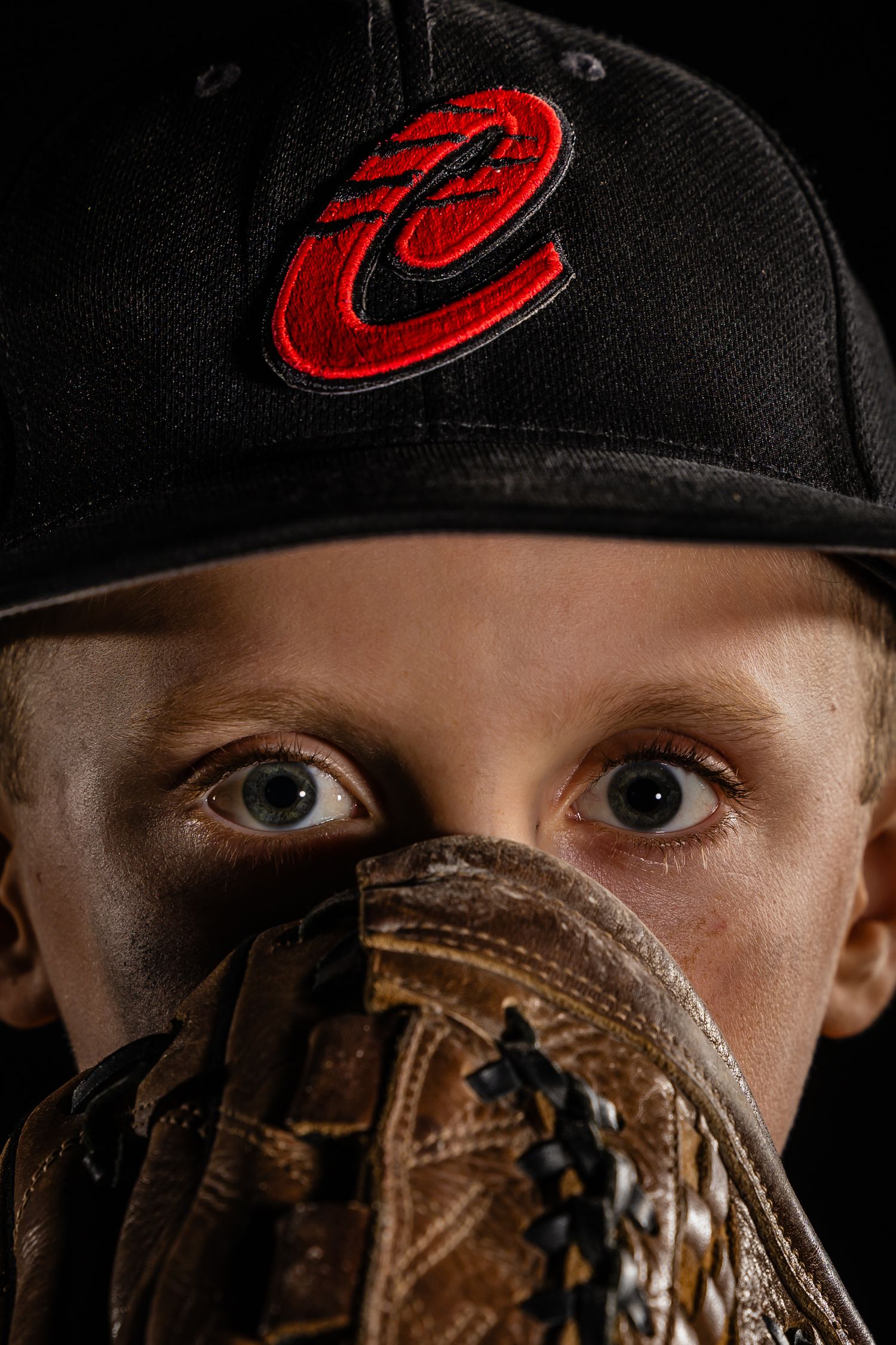 Grimsby Coyote Boys Baseball player posing for an outdoor portrait session in Grimsby Niagara