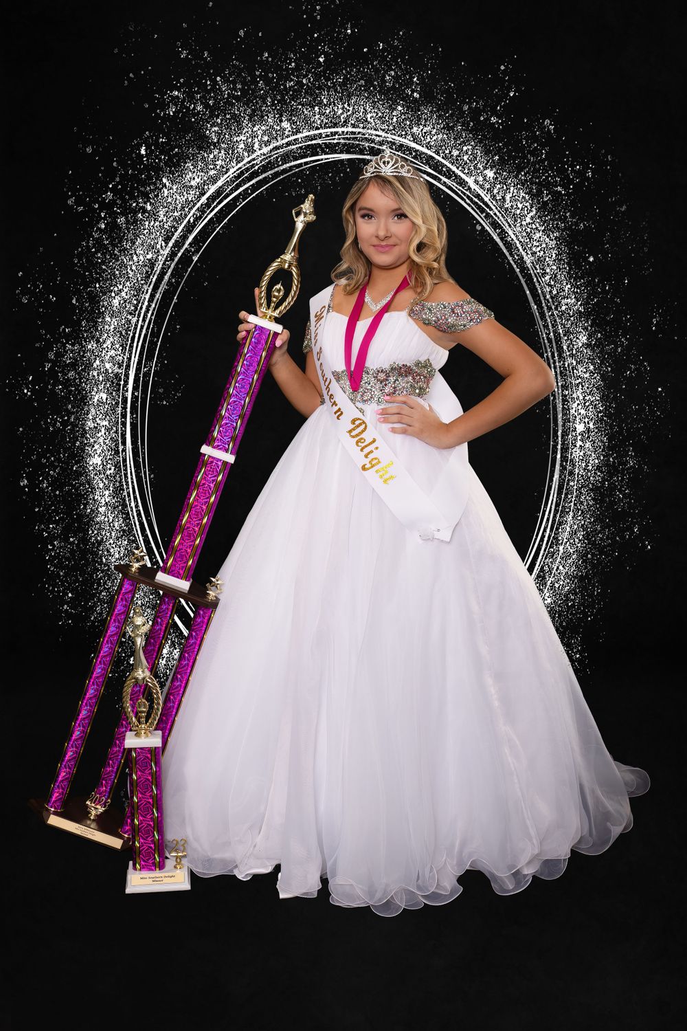 Formal portrait with white ball gown and purple trophy against black background with sparkle frame.