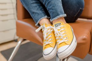 Detail photo of a stylist’s shoes during a salon branding session in Bloomington, Illinois by Julie Loy Photography