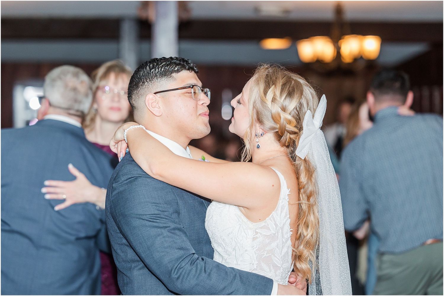 Couple shares an intimate dance moment during their wedding reception.