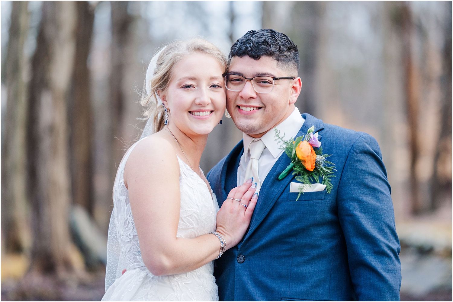 A couple shares a joyful moment together during their wedding portraits.