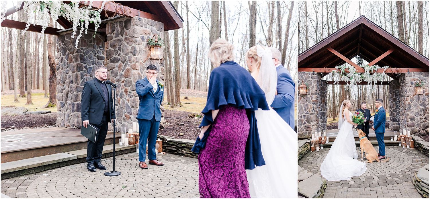 Winter woodland wedding ceremony with rustic stone and wood architecture.