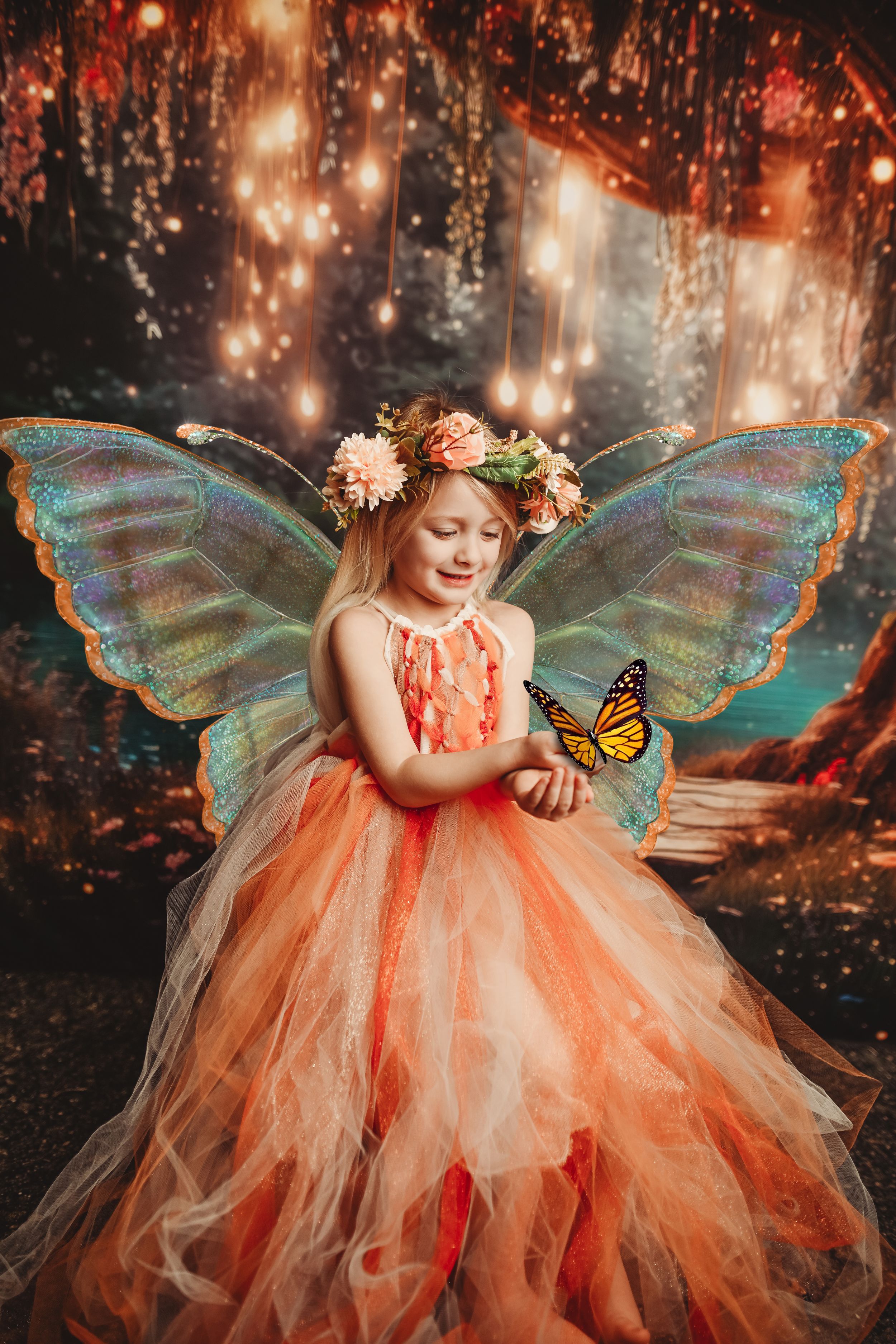 Whimsical fairy garden scene with butterfly and peach tulle costume.