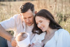 Couple sharing intimate moments together in a romantic outdoor photoshoot at golden hour.