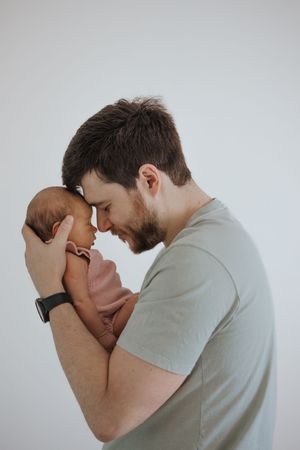 Three sequential photos show a couple in an intimate embrace against a white background.