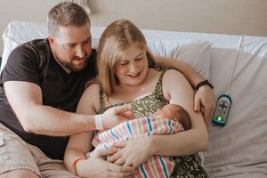 A series of tender family moments captured on a bed with a newborn baby and parents in soft, natural lighting.