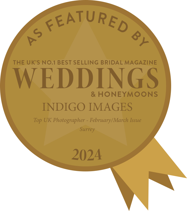 Gold seal badge for featured photographers in Weddings & Honeymoons magazine 2024 edition.