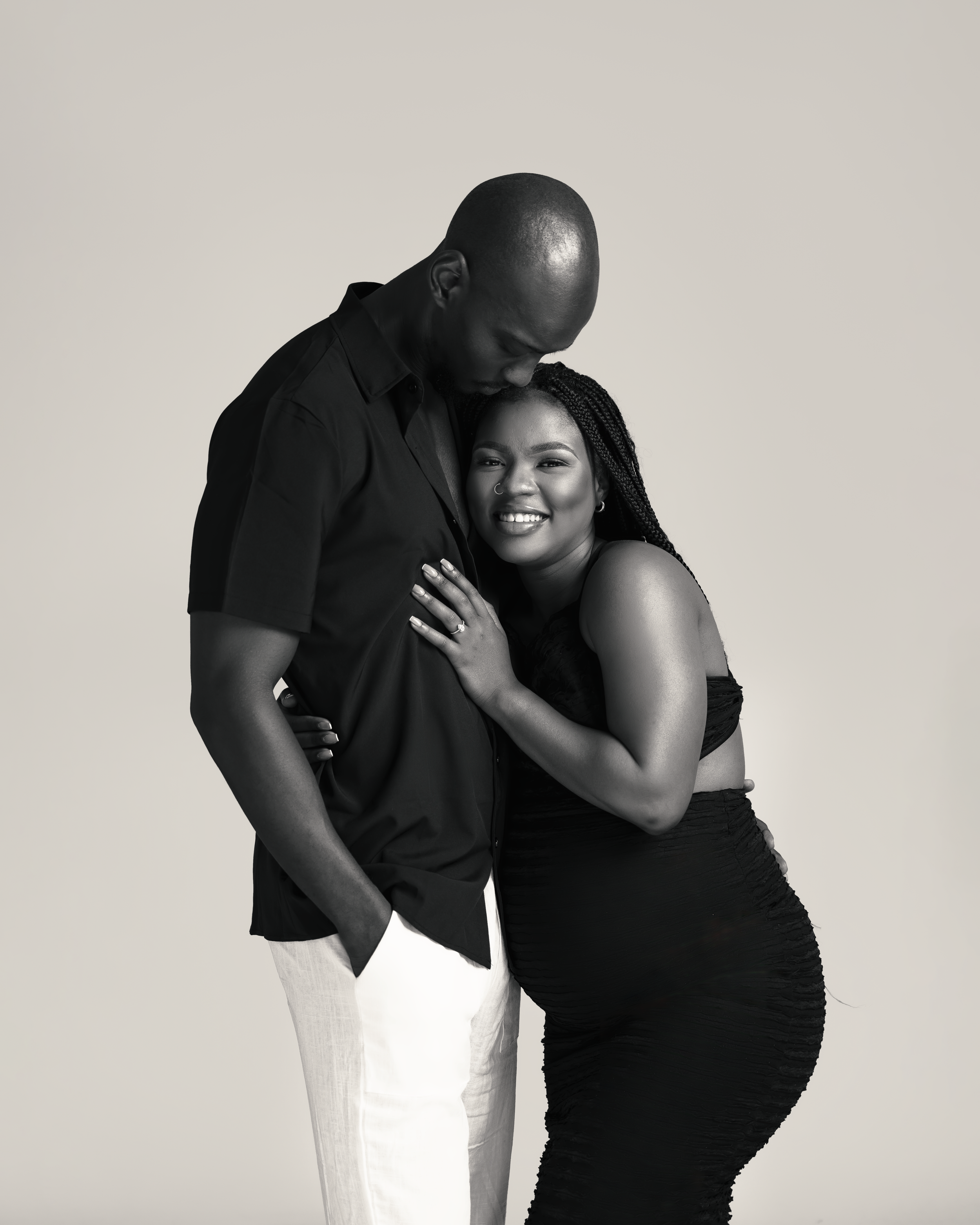 Joyful black and white portrait of couple sharing intimate moment.