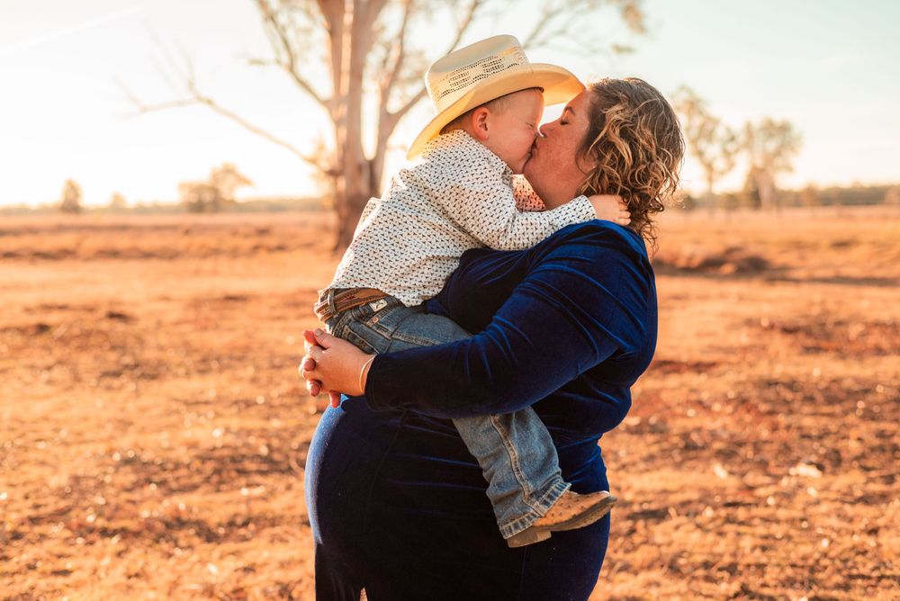 An intimate family moment captured during sunset in the Australian outback.