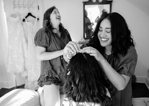 A black and white photo collage shows candid moments of laughter and joy between two people in casual settings.
