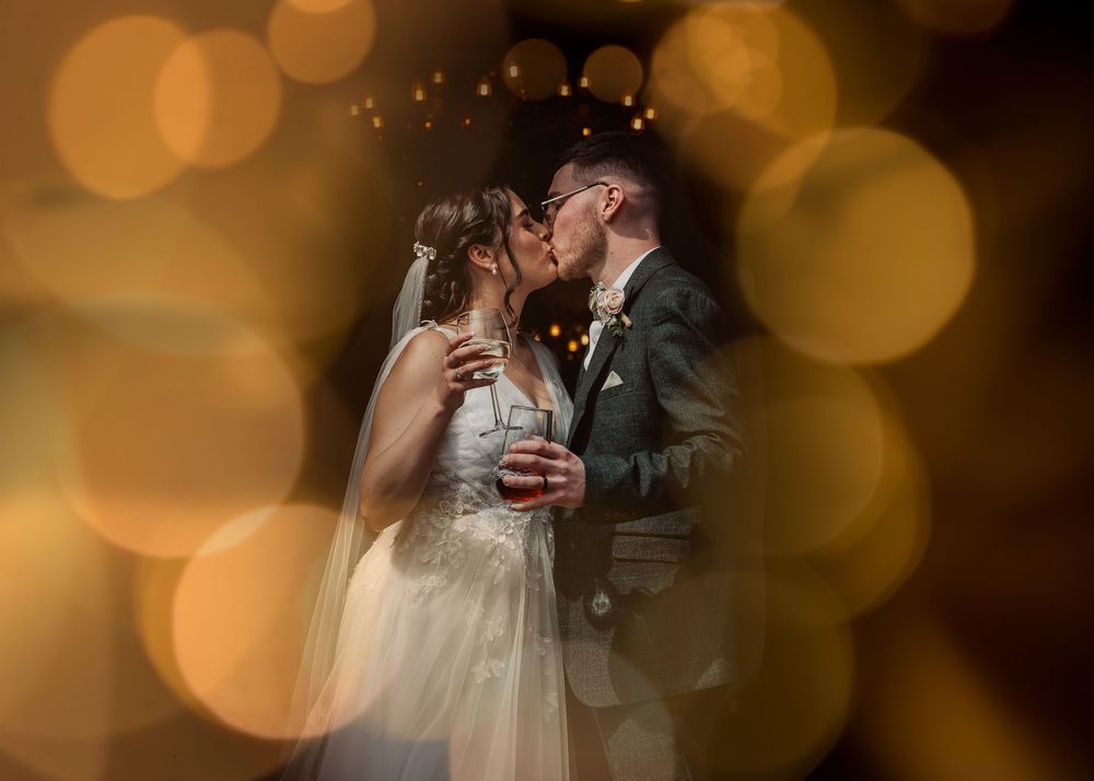 bride and groom kissing outside after ceremony