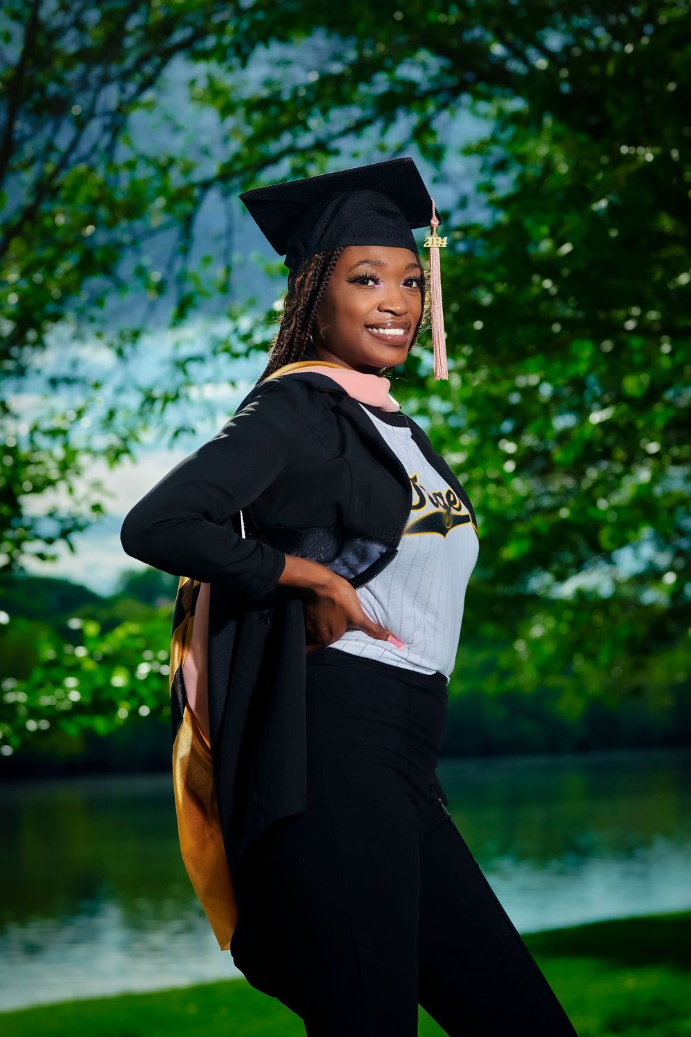 Graduation photos showing celebratory poses with cap and gown against natural scenery.