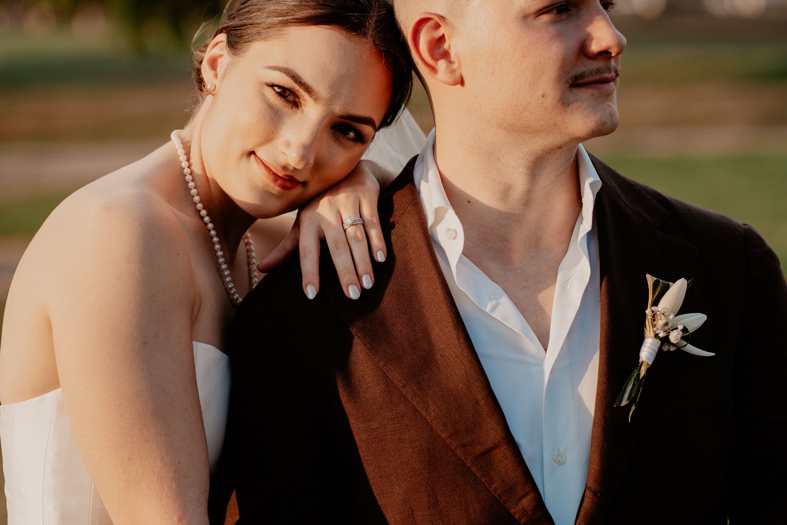 A couple shares intimate moments in a series of romantic wedding photos captured during golden hour.