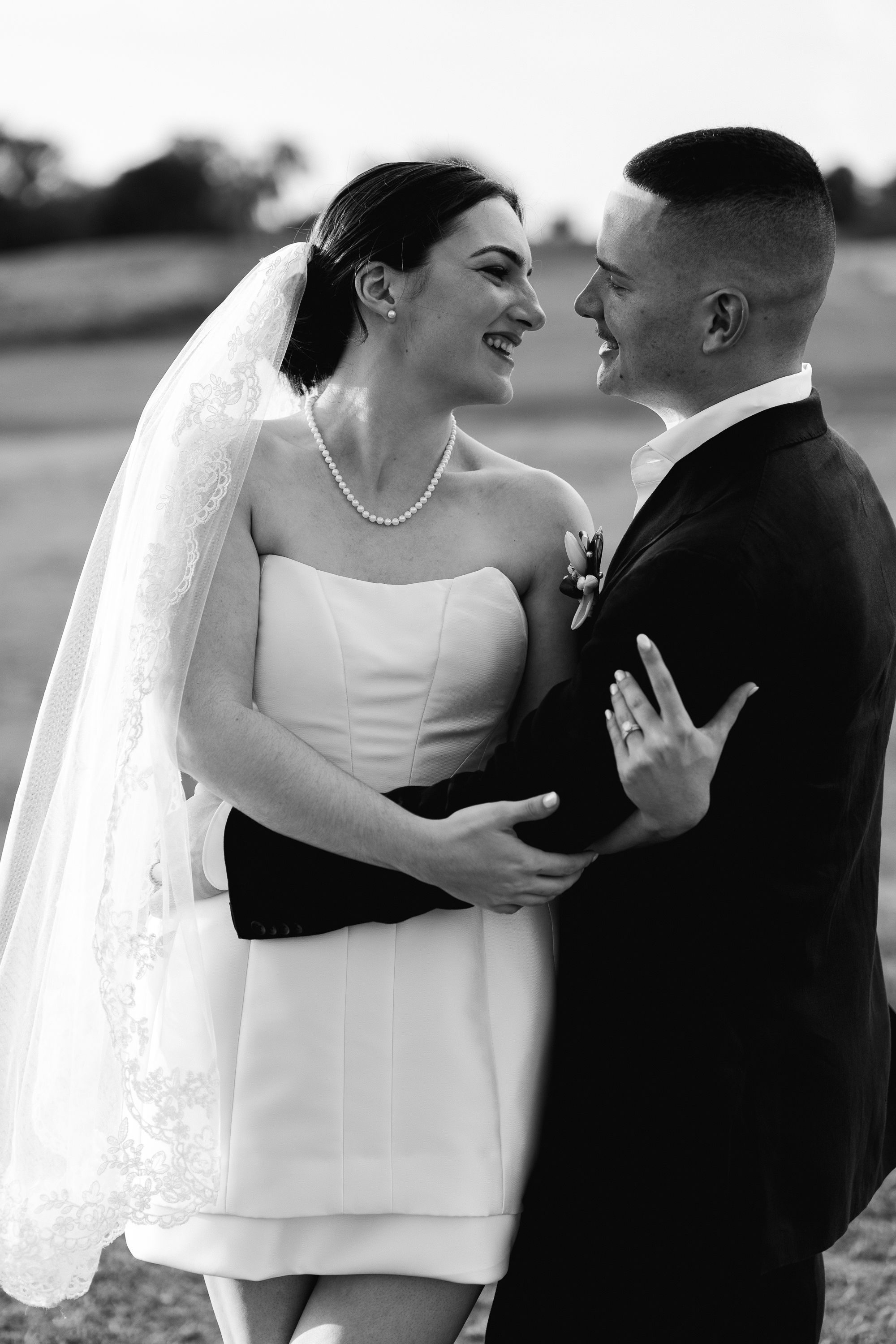 A romantic black and white wedding photography sequence showing tender moments between a couple in formal attire.