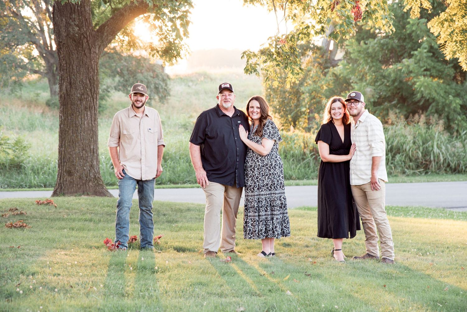 A family with adult children's portrait at sunset under a tree in Princeton, Kentucky