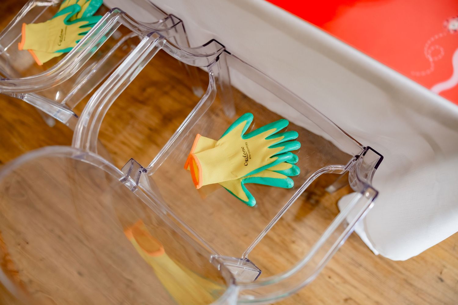 Clear party favor boxes containing yellow and green paper decorations.