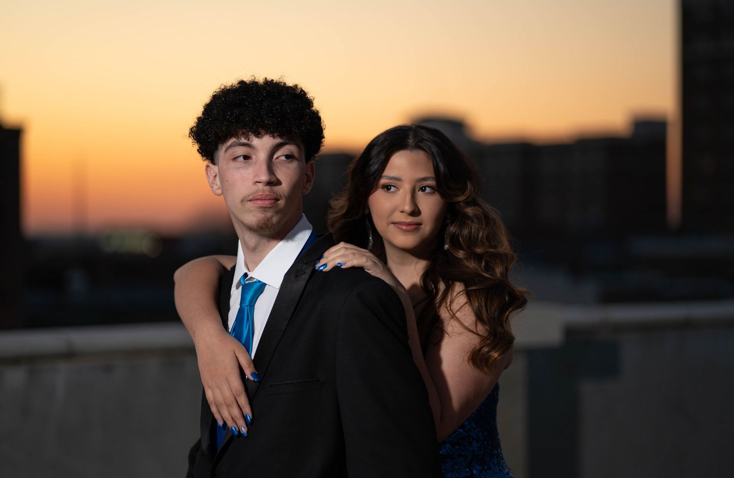 couple staring into the distance at sunset