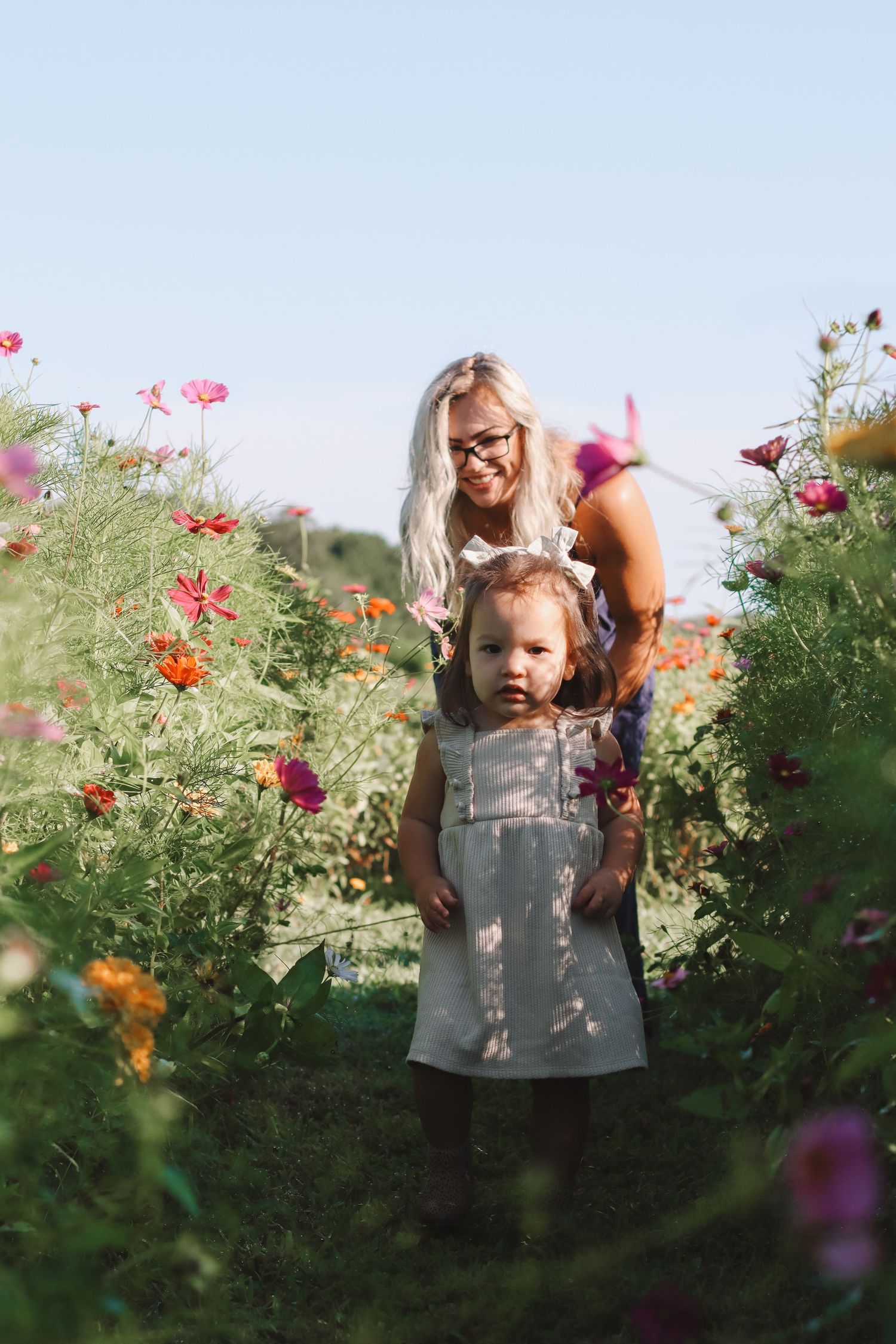 mother and daughter in wildflower fields