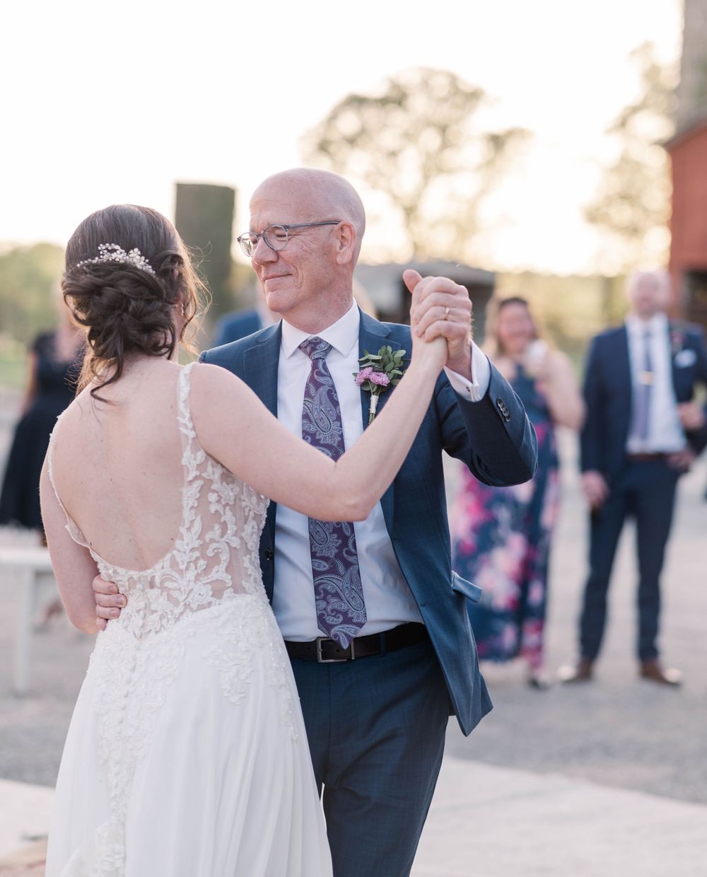Couple sharing special dance moment at outdoor wedding reception. The 1932 Barn Venue, Charlotte, NC