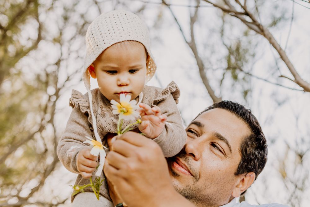 Father with lifting up baby liv in Family Photo session Marbella