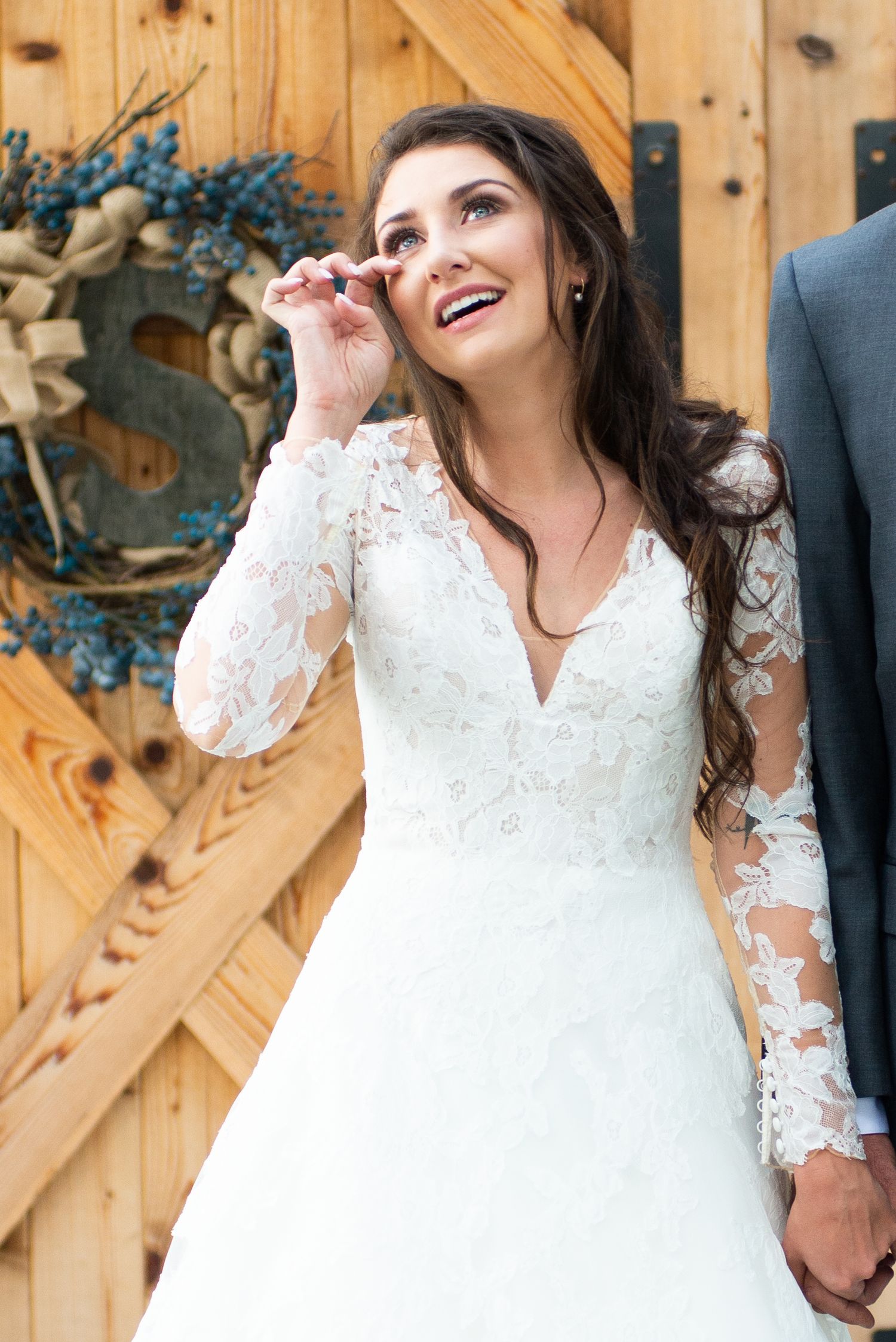 bride brushing back a tear