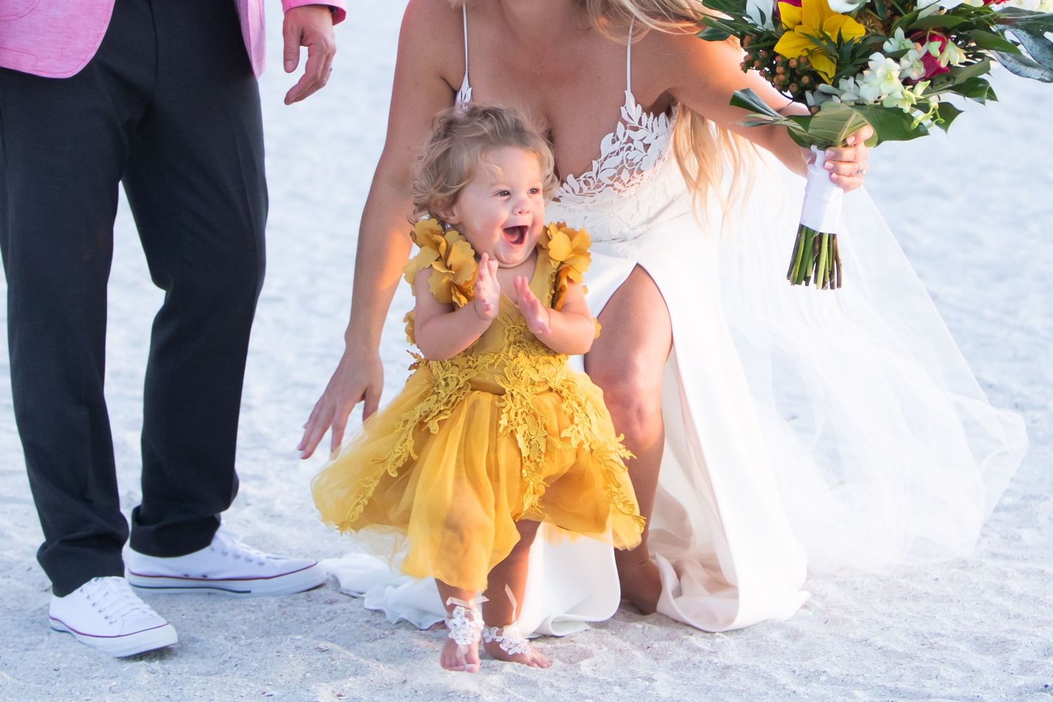 baby girl happy at her moms wedding