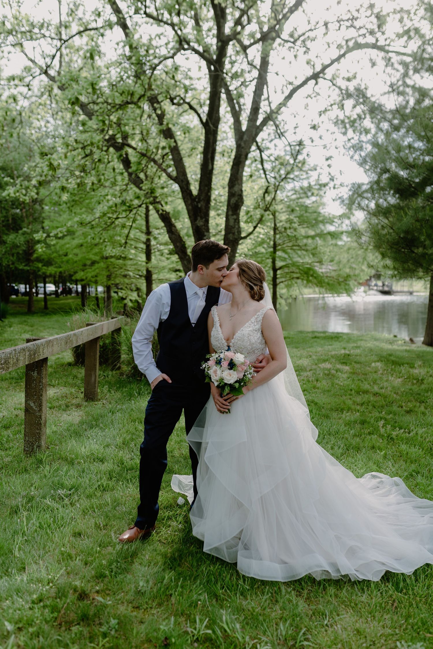 Wedding couple sharing intimate moments in a spring garden setting.