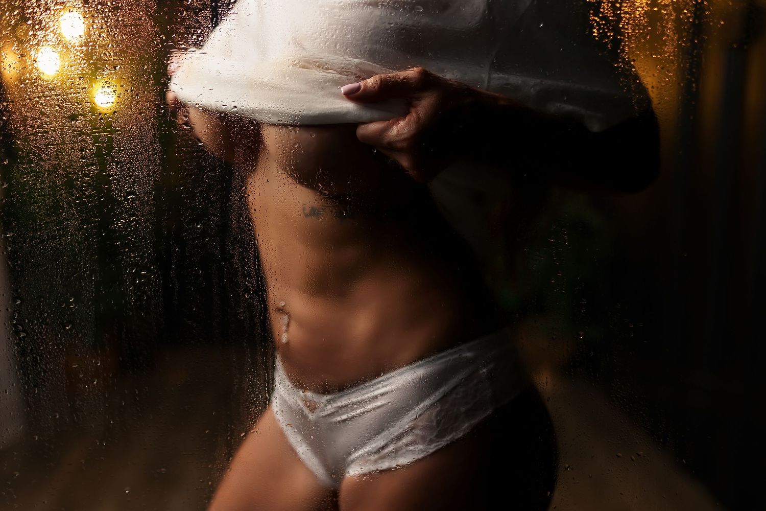 romantic boudoir portrait with dramatic side lighting