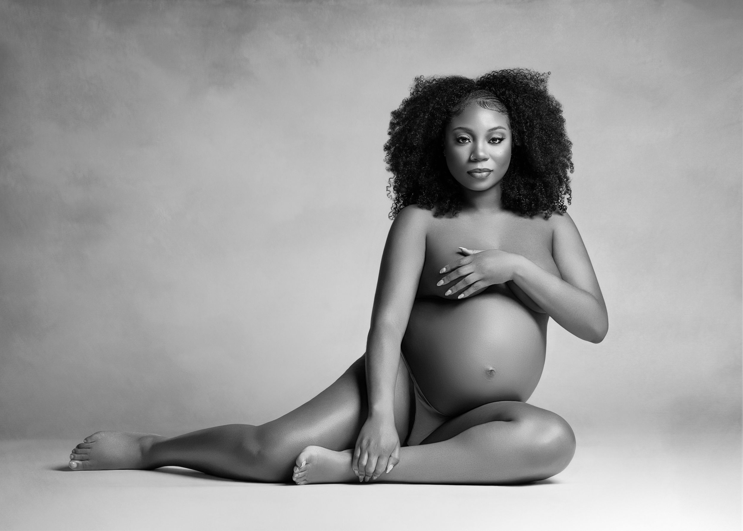 A series of artistic black and white nude figure studies showing graceful poses against a light background.