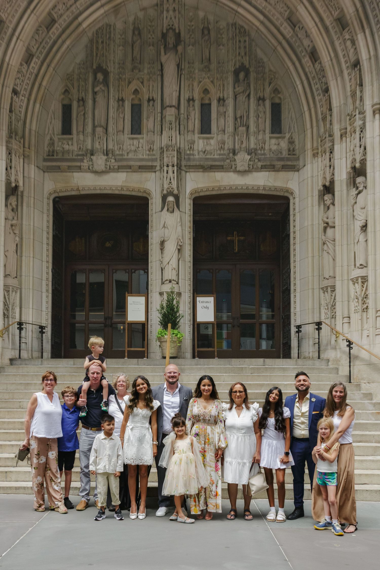 Family group portrait with St. Thomas Church facade in NYC by Paula Brearley